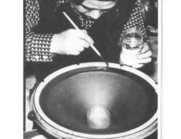Photograph from Le Audiophile, Article page 68. Jean Hiraga is shown manually applying a damping compound to a loudspeaker cone.