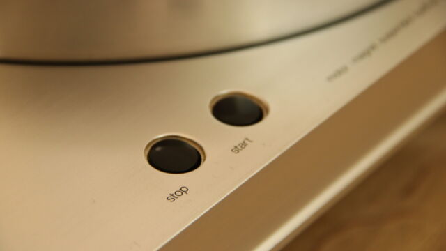 The Luxman PD-444 start and stop button